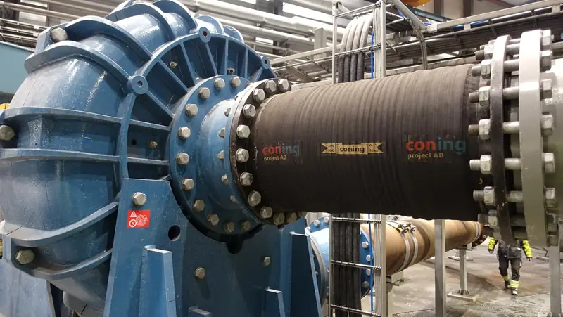 CONING-branded slurry hose installed on a slurry pump.